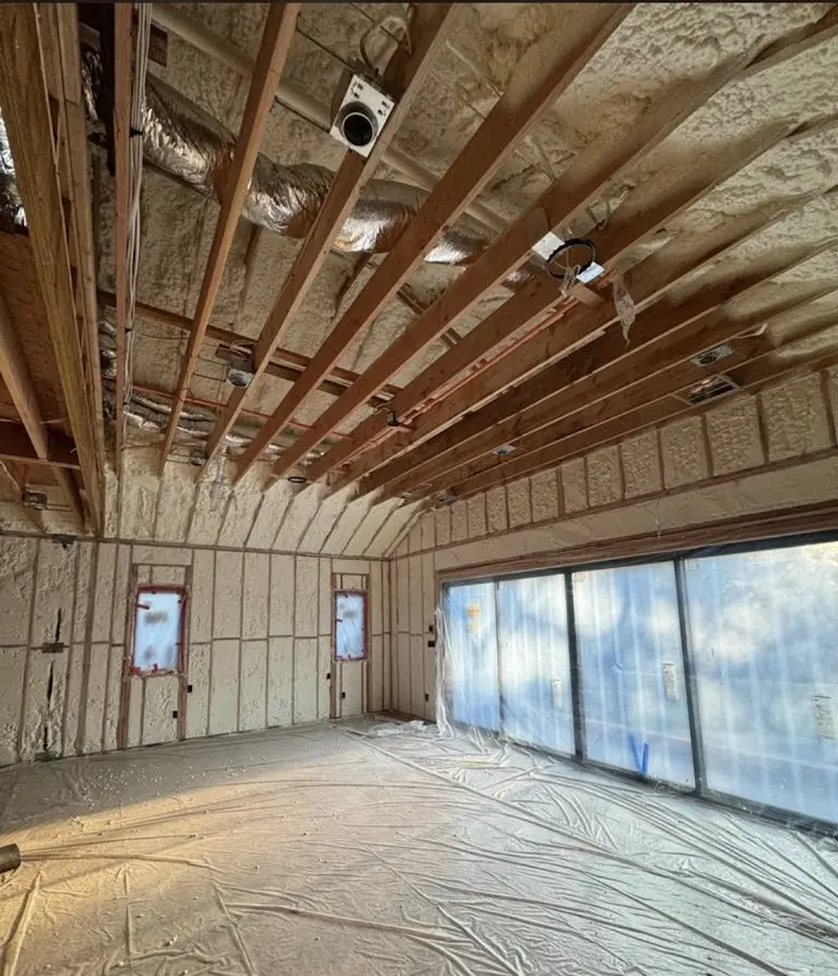 Interior walls and ceiling insulated with spray foam during new construction in Ontwa