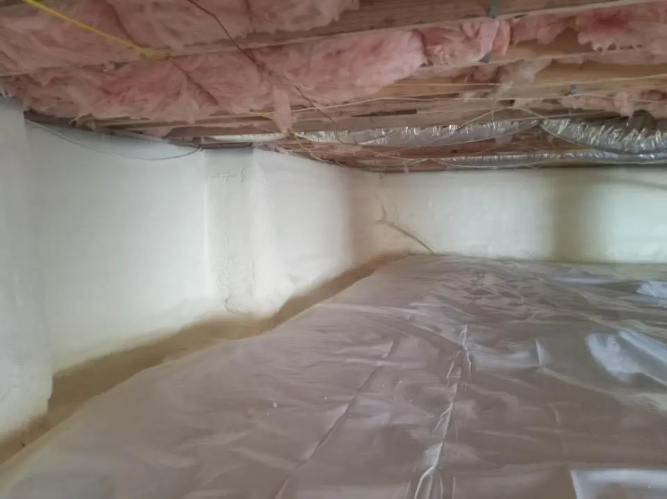 Crawl space encapsulation with closed-cell spray foam for Commercial Roof Restoration in Ontwa